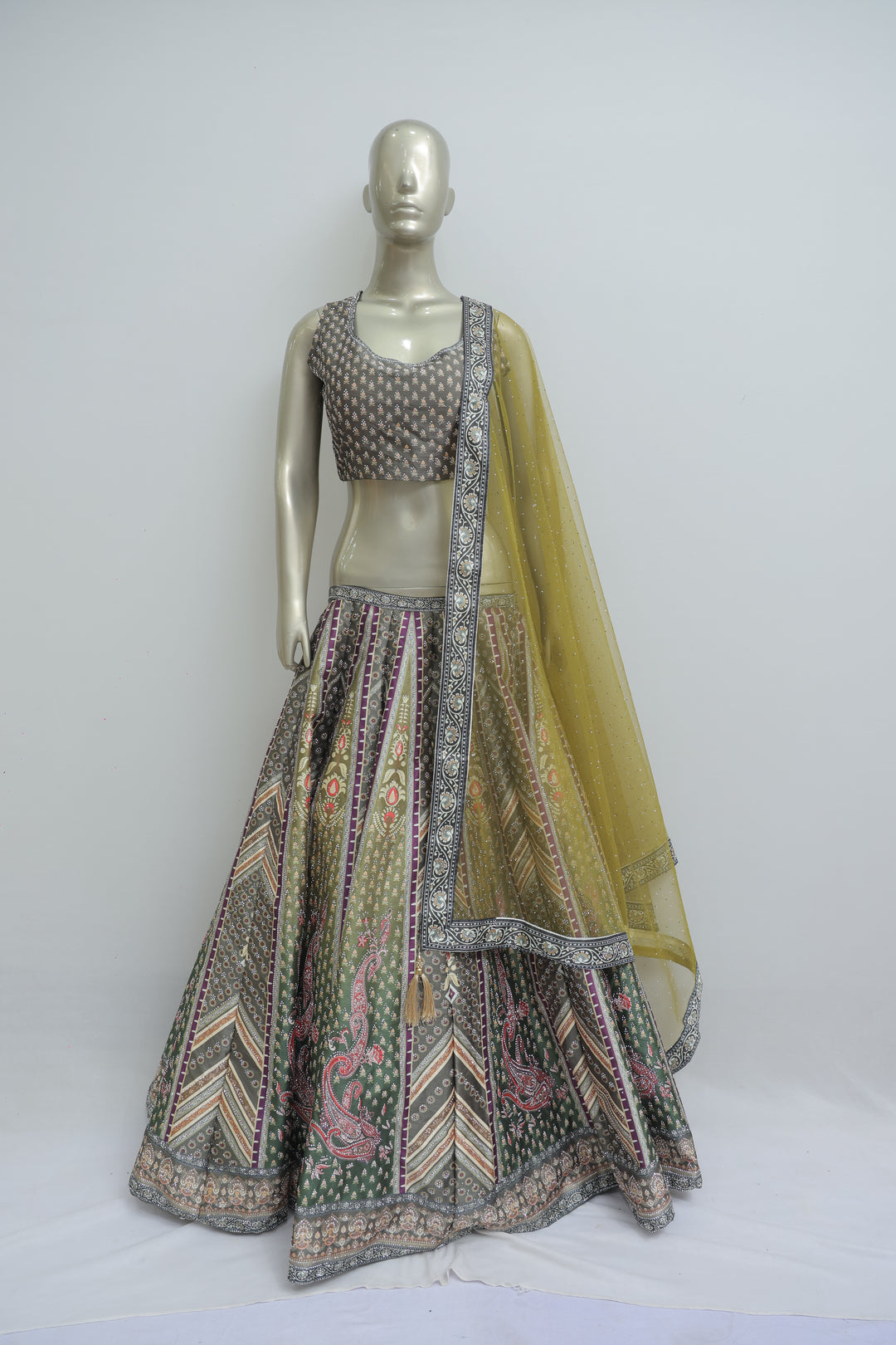 Stitched lehenga with top in raw silk fabric
